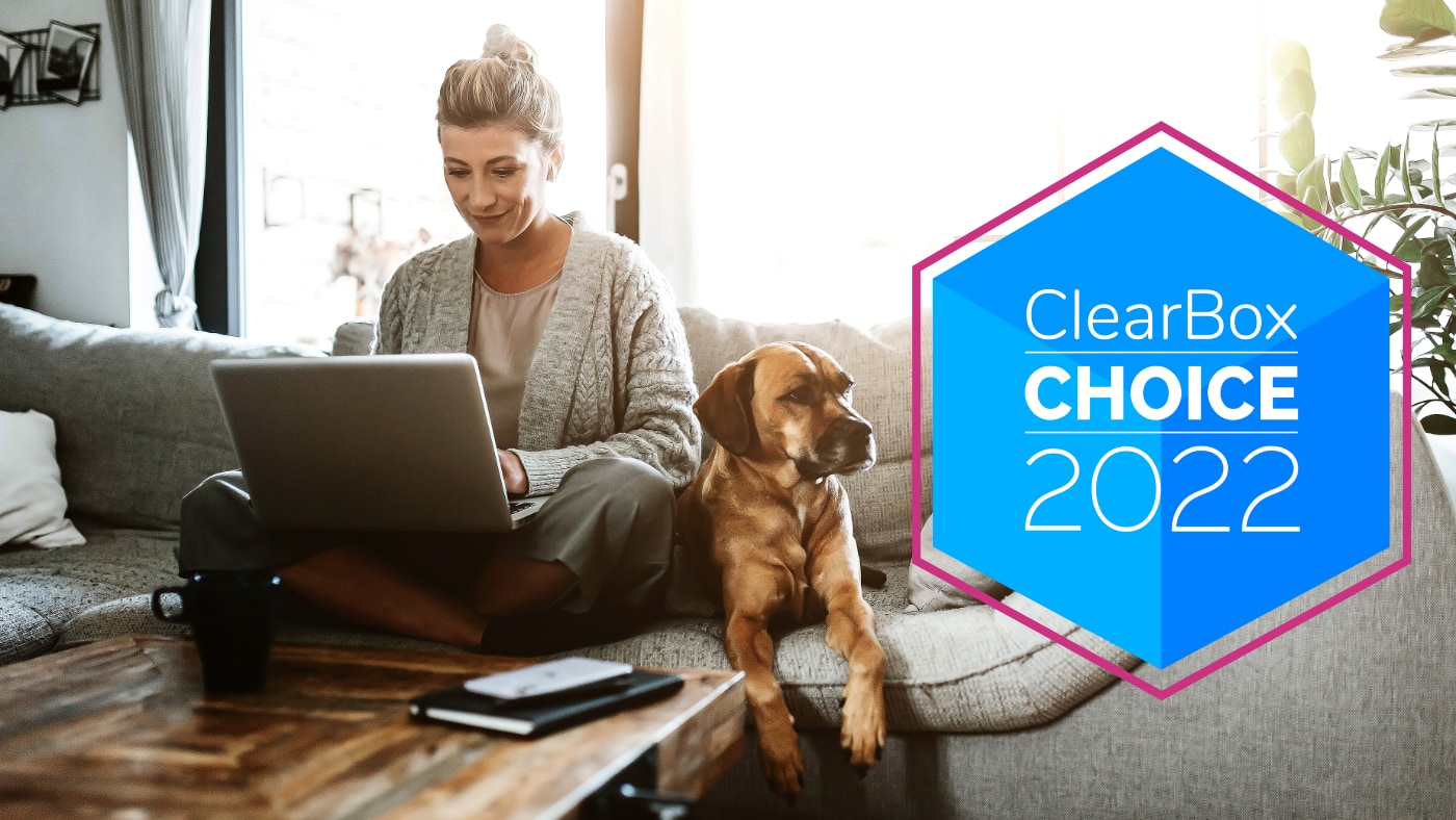 ClearBox Choice 2022, on a blue hexagon, overlaid upon a photo of woman on laptop with a dog.