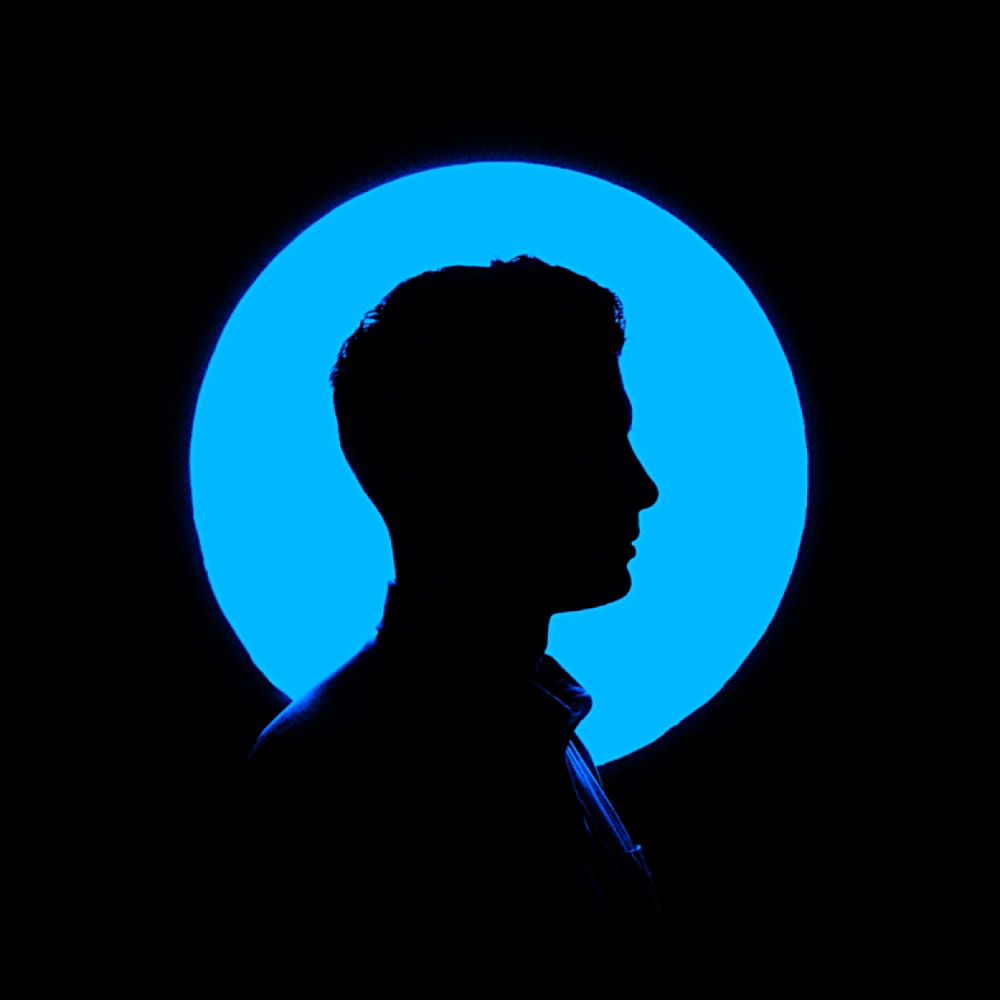 A silhoutte profile pic against a blue circle.
