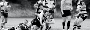 Rugby players mid-tackle.