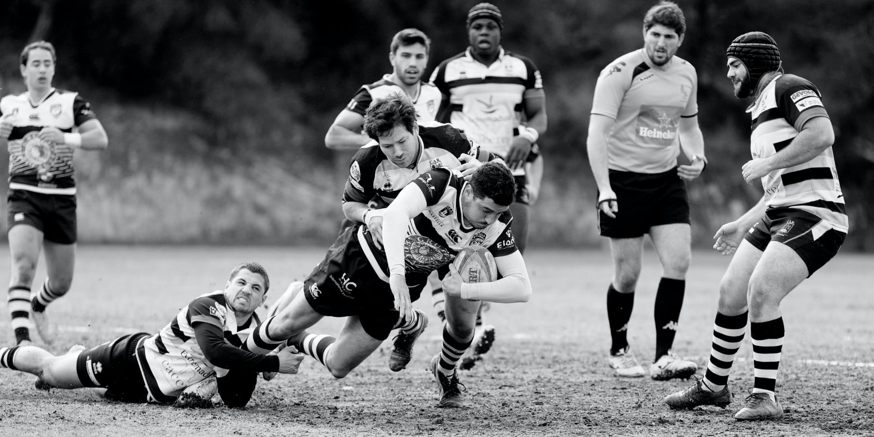 Rugby players mid-tackle.